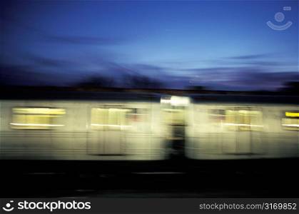 Public Transit Cars Speeding By In The Night