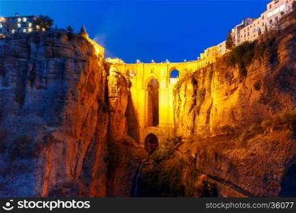 Puente Nuevo, New Bridge, at night illuminated over the Tajo Gorge in Ronda, Andalusia, Spain