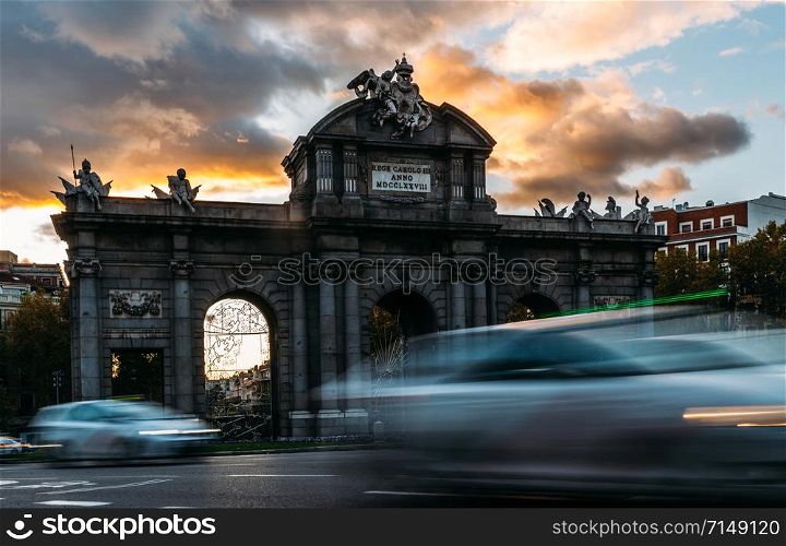 Puerta de Alcala, Gate or Citadel Gate is a Neo-classical monument in the Plaza de la Independencia in Madrid, Spain - long exposure deliberate motion blur. Puerta de Alcala, Gate or Citadel Gate is a Neo-classical monument in the Plaza de la Independencia in Madrid, Spain