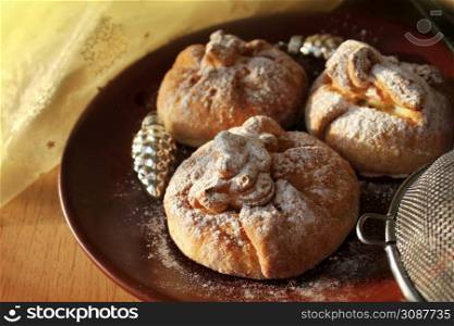 Puff pastries with apple on the wooden background .. Puff pastries with apple on the wooden background
