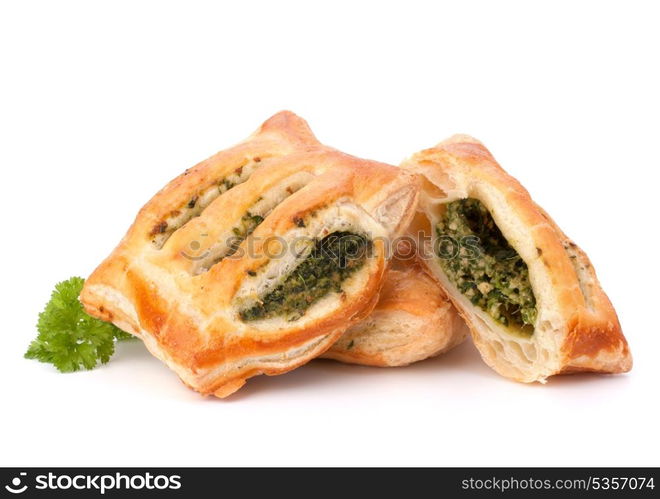 Puff pastry bun isolated on white background. Healthy patty with spinach.