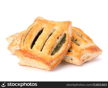 Puff pastry bun isolated on white background. Healthy patty with spinach.