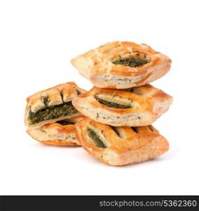 Puff pastry bun isolated on white background. Healthy patty with spinach.