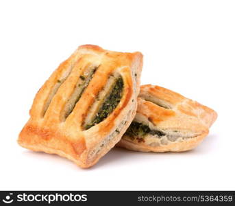 Puff pastry bun isolated on white background. Healthy patty with spinach.