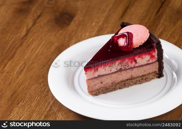 puff pastry in a round white plate on a wooden surface with reflection. ice cream on round plate