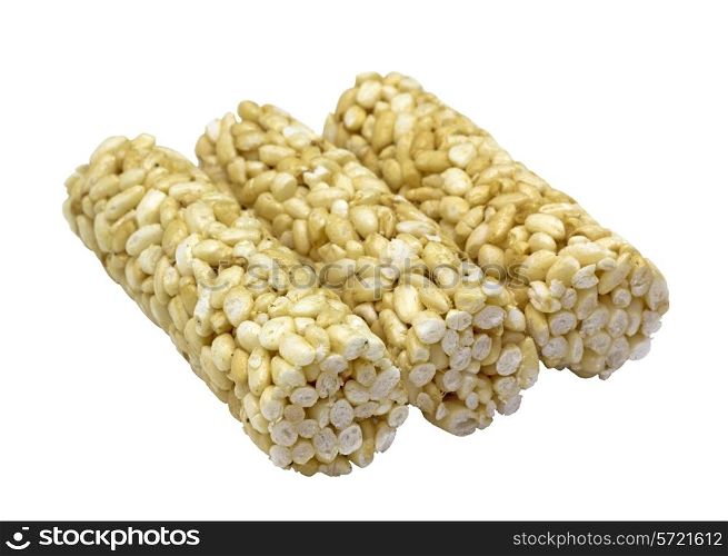 Puffed rice in honey on a white background