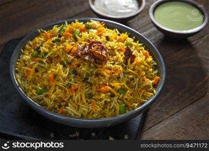 Pulao an Indian speciality, a dish made of rice with mint chutney