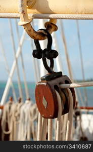 Pulley block. Detail of a passenger cruise ship sailing in the Society Islands, Tahiti. . Travel and Stock Photography