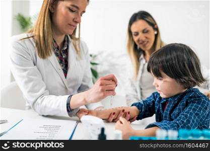 Pulmonologist Doing Skin Allergy Test on Little Boy . Pulmonologist Doing Skin Allergy Test