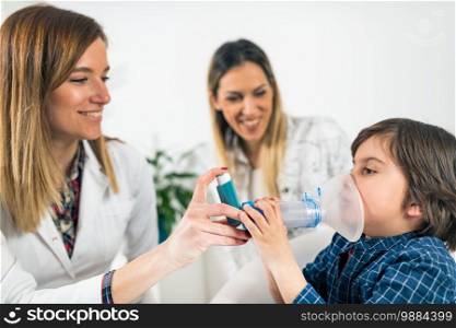 Pulmonology Doctor Helping Little Boy with Inhaler. Doctor Helping Little Boy with Inhaler