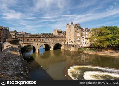 Pulteney Bridge and Weir on the River Avon in the historic city of Bath in Somerset, England .. Pulteney Bridge and Weir on the River Avon in the historic city of Bath in Somerset, England.