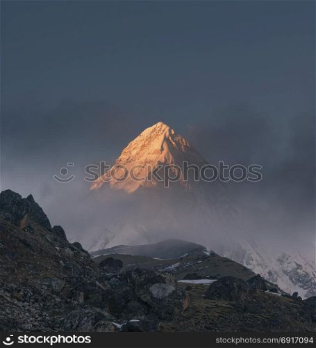 Pumori summit or peak at sunset or sunrise. Everest base camp trek, tourism in Nepal