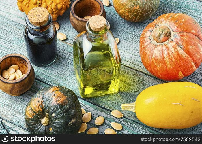 Pumpkin and healthy pumpkin seed oil.Autumn food. Natural pumpkin seed oil