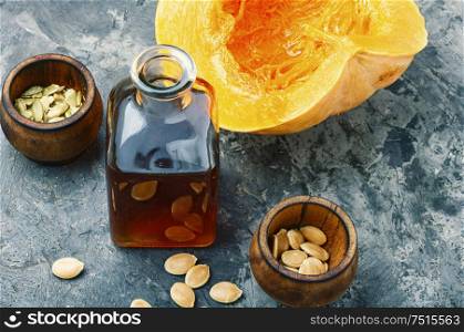 Pumpkin and healthy pumpkin seed oil.Autumn food. Natural pumpkin seed oil