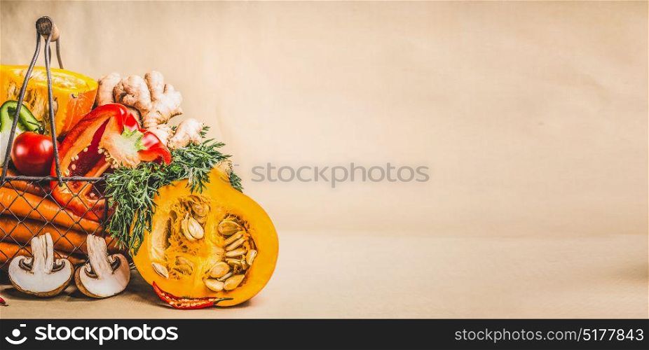 Pumpkin and organic seasonal vegetables for vegetarian and healthy cooking, front view, banner