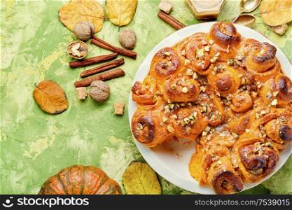 Pumpkin buns with nuts and brown sugar.Cinnamon rolled pumpkin buns. Freshly baked cinnabon buns