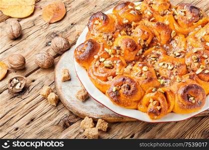 Pumpkin buns with nuts and brown sugar.Cinnamon rolls or cinnabon. Cinnabon cinnamon rolls