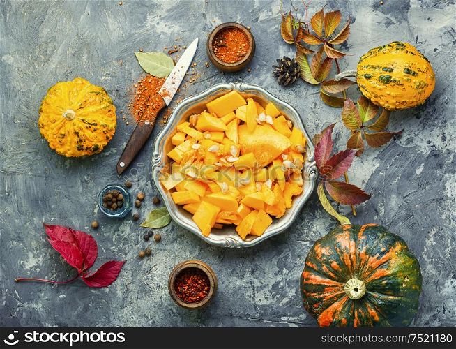 Pumpkin cut in a pieces.Autumn vegetarian cooking. Piece of pumpkin