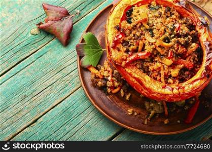 Pumpkin halves stuffed with minced meat,vegetables and quinoa.Autumn stewed pumpkin hokkaido. Roasted pumpkin with minced meat and quinoa