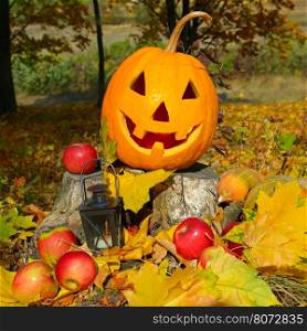 pumpkin-head against a background of an autumn forest