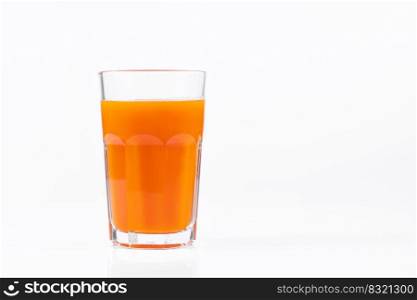 Pumpkin juice in transparent glass isolated on white background. Vegetable vegetarian drink. Healthy food and diet concept.. Pumpkin juice in transparent glass isolated on white background. Vegetable vegetarian drink. Healthy food and diet.