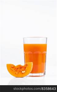 Pumpkin juice in transparent glass isolated on white background. Vegetable vegetarian drink. Healthy food and diet concept.. Pumpkin juice in transparent glass isolated on white background. Vegetable vegetarian drink. Healthy food and diet.
