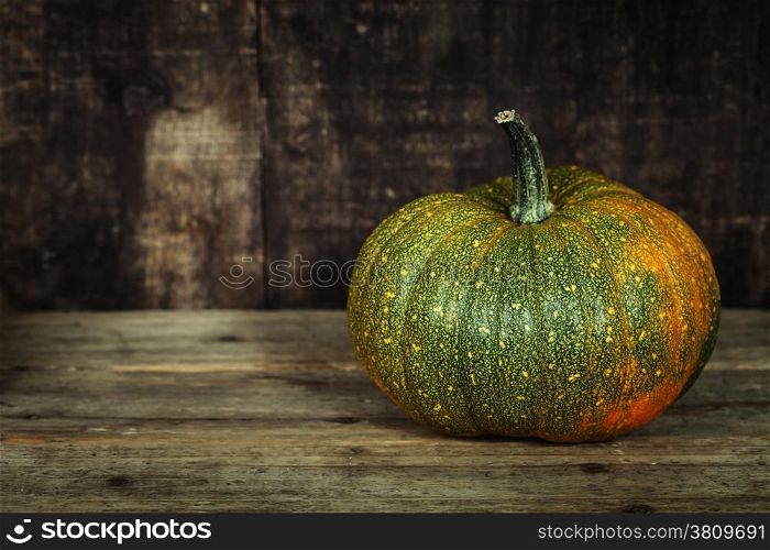 Pumpkin on old wooden table