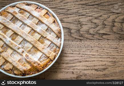 Pumpkin pie on the wooden background
