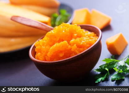 pumpkin porridge in bowl and on a table