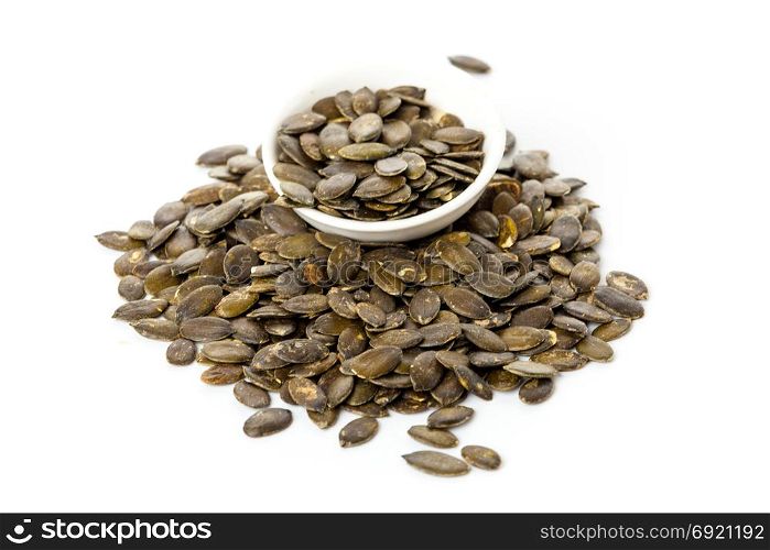 Pumpkin seeds isolated on white background