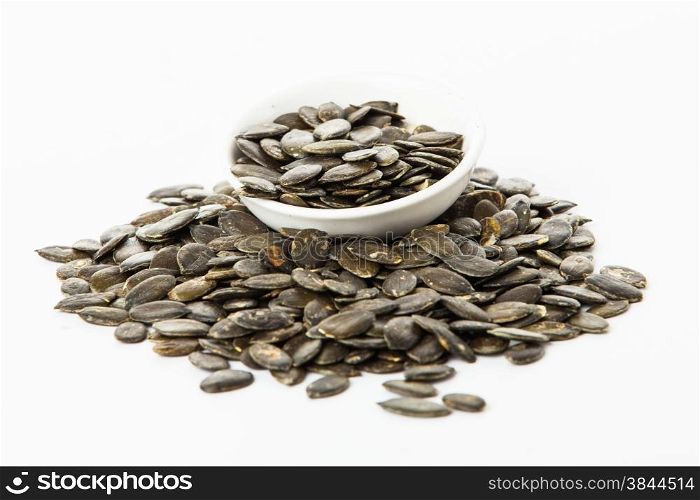 pumpkin seeds isolated on white background. Fresh roasted Pumpkin Seeds