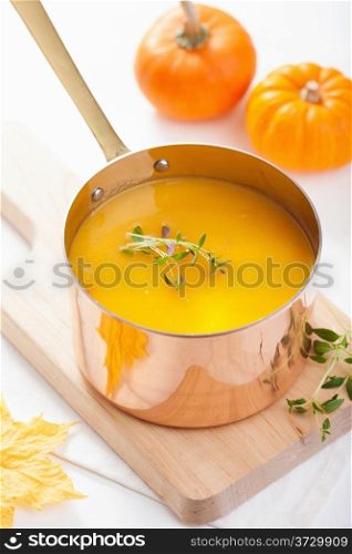 pumpkin soup in copper pot