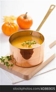 pumpkin soup in copper pot