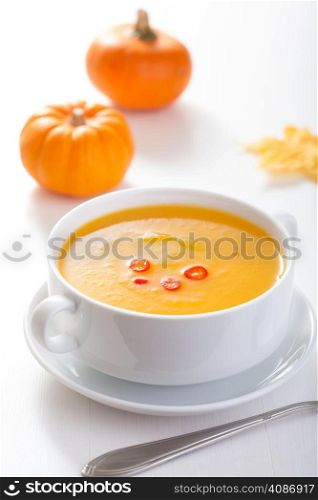 pumpkin soup in white bowl