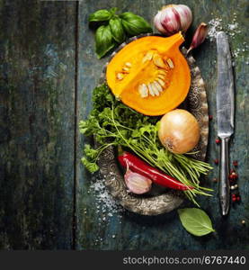 Pumpkin soup ingredients on wooden background close up