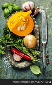 Pumpkin soup ingredients on wooden background close up