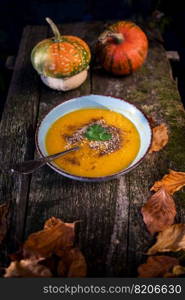 pumpkin soup on wooden table autumn dish