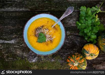 pumpkin soup on wooden table autumn dish