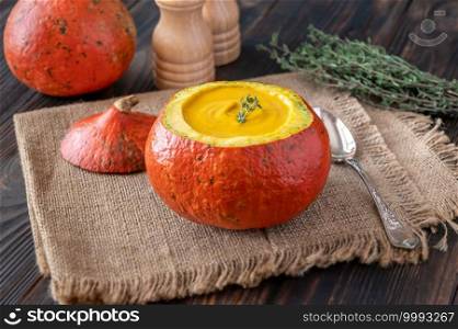 Pumpkin soup served in the hollowed out hokkaido pumpkin