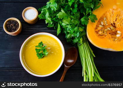 Pumpkin soup served on the table in bowl