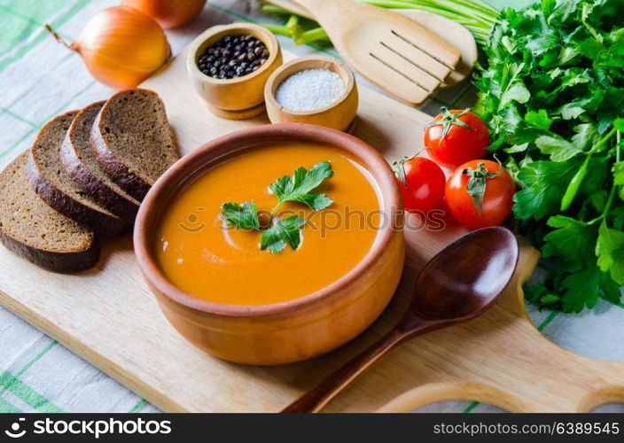 Pumpkin soup served on the table in bowl