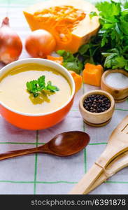 Pumpkin soup served on the table in bowl