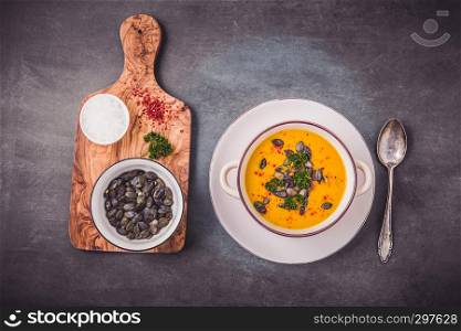 Pumpkin soup with pumpkin seeds and chili peppers