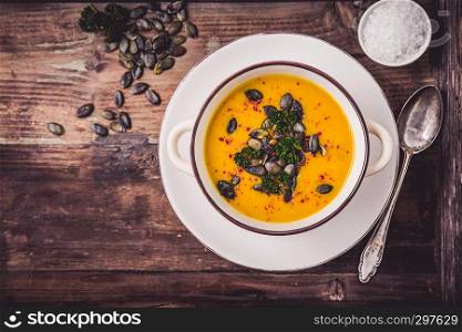 Pumpkin soup with pumpkin seeds and chili peppers