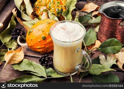 Pumpkin spice latte.Cup with autumn coffee.Coffee drink.Autumn hot drink. Pumpkin spice coffee with whipped cream