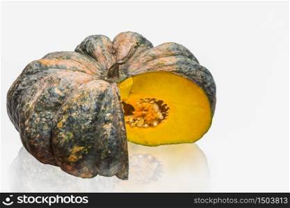 Pumpkin yellow with green peel isolated from the white background is vegetable from Thailand.