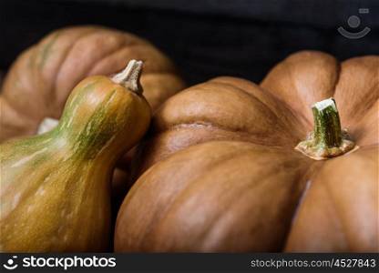 pumpkins lying on a wooden table