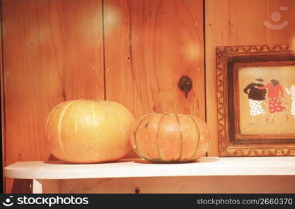 Pumpkins on a shelf