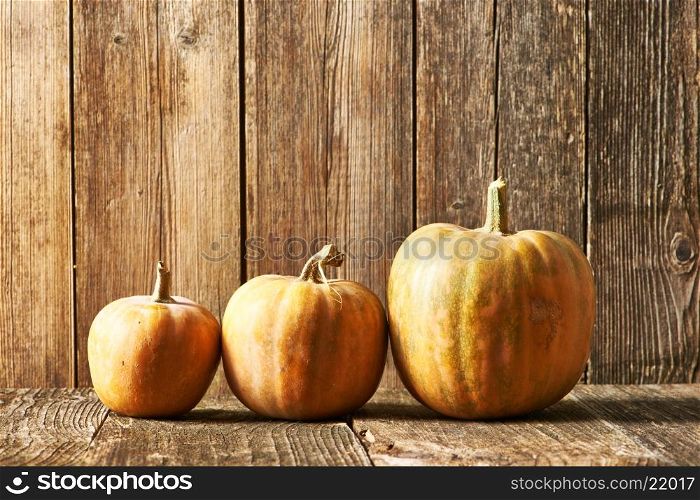 Pumpkins on old wooden table