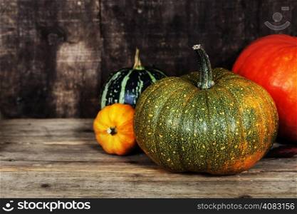 pumpkins on old wooden table